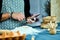 Man using electronic tablet pc in kitchen at home for baking. Man searching for food recipe in tablet computer.