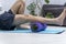 Man using foam myofascial roller for muscle and fascia stretching foot. Equipment for MFR. Self-massage of feet