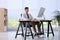 Man using footrest while working on computer