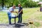 Man is using handle for taking out sausages from barbecue