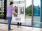 Man using his credit card in an atm for withdrawal