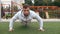 Man is using his strength to do push up