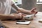 Man using home blood pressure machine to check his vital statistics.