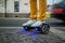 Man is using hoverboard against the background of leaving car