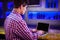 Man using laptop at bar counter