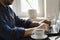 Man using laptop in home office. Male hands typing on keyboard