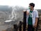 Man Using Mask Looking at Volcano Tangkuban Perahu Mountain, West Java, Indonesia