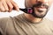 Man using microneedling as a beard growth treatment