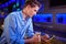 Man using mobile phone at bar counter