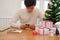 man using mobile smart phone with christmas decoration. xmas new