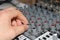 Man using music mixer hand close up
