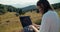 Man using portable modern device on summer mountain journey