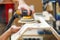 A man using a power tool electric sander to craft wood in the carpentry trade