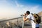 Man using public binoculars at the mountain top