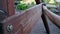 Man using sand paper on wooden bench