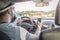 Man using smartphone during car drive. Dangerous driving concept