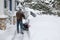 Man using snowblower in deep snow