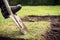 Man using spade for old lawn digging, gardening concept