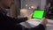 Man Using Tablet in Coffee Shop. Tablet with Green Screen. So you can easily crop and zoom, Great for presentation and