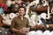 Man using tablet in fabric storage warehouse, portrait