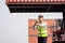 Man Using Walkie Talkie At Container Terminal, Industrial worker is controlling container loading