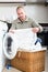 Man using washing machine