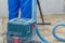 the man vacuums the tile after laying. preparation for jointing