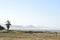 Man with video camera on tripod in beach coast landscape Baja, Mexico