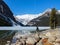 Man viewing Lake Louise and mountains