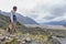 A man at viewpoint along walking trail to the Blue Lakes and Tasman Glacier View in Aoraki / Mount Cook National Park