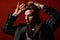 Man in vintage style combs his hair on red background.