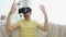 Man in virtual reality headset playing game