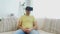 Man in virtual reality headset playing game