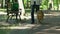 Man with visual impairment walking in park with his specially trained dog, help