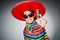 The man in vivid mexican poncho holding handgun