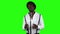 Man vocalist sings into a microphone and dance. Green screen. Slow motion