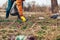 Man volunteer cleaning up the trash in park. Picking up rubbish outdoors. Ecology and environment concept