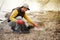 Man volunteer lift off garbage in beach. Coastline environment pollution, outdoor trash and rubbish