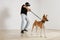 Man VR glasses holding a dog\'s leash