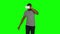 Man in the VR mask something crosses legs in the air. Green screen