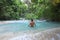 Man wading in tropical paradise pool