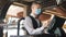 Man or waiter in medical mask at counter with cashbox working at bar or restaurant