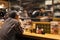 Man is Waiting for his Order and Drinking Beer in the Japanese Restaurant