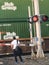 A man waiting for the train to pass