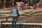 Man Waiting for Work on Bridge Construction