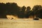 Man wakeboarding on lake behind boat