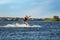 Man wakeboarding on river. Extreme water sport