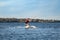 Man wakeboarding on river. Extreme water sport