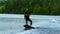 Man wakeboarding on river. Water sport activity in slow motion