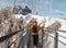 Man walking across rope bridge on Dachstein mountain